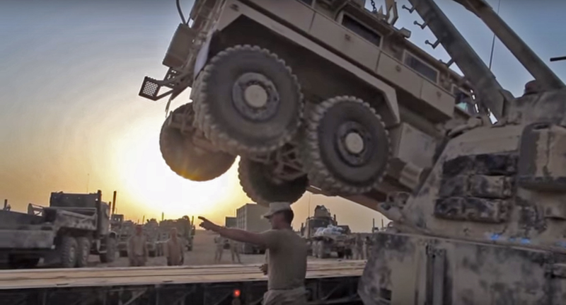 Illustration for article titled It Takes Three Extreme Machines To Flatbed An MRAP With A Blown Tire